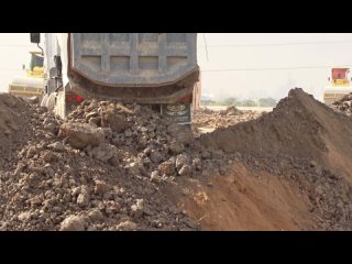 Incredible heavy dump truck unloading dirt on new construction- Bulldozer pushing with amazing skill