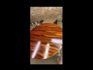 Applying varnish to a wooden table