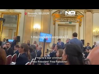 A speech by Ursula von der Leyen was briefly interrupted by a man who accused her of being a criminal over her support for Isr