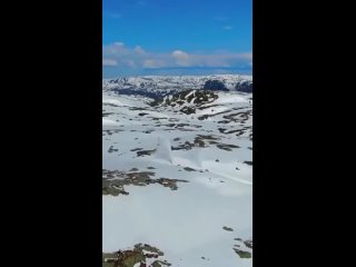 Clearing snow on Norwegian mountain roads after heavy seasonal snowfall