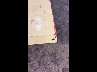 Pressure washing the paint off a tractor canopy after a chemical paint removal Dip