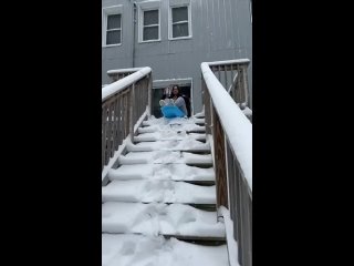 The way the snow slides off the railing and directly onto her at the end