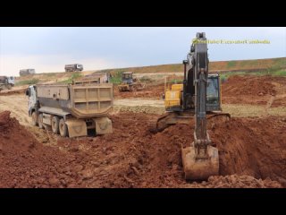 Big Volvo  Matador Excavator Loading Soil In To Dump Trucks.