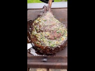 Tomahawk steak with a garlic and herb compound butter (720p).mp4