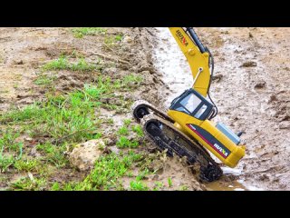 Tractor RC Bulldozer rides on the mud