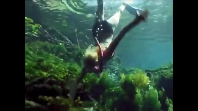 Woman snorkeling in river 1990s