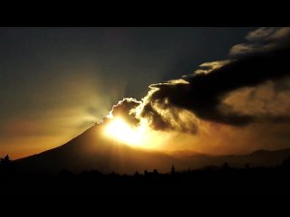 Popocatepetl volcano eruption at sunset