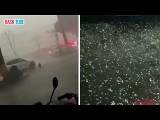 На пострадавшую от наводнения китайскую провинцию Гуандун продолжают накатывать сильные штормы, ливни и град