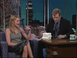 Rebecca Romijn teaches Conan how to play Suck and Blow.