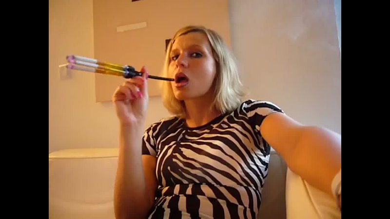 Woman smoking 3 cigarettes at once with