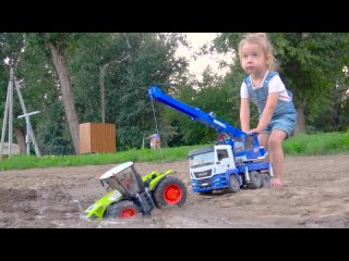 Darius Playing with Tractor Mud Racing and bridge building