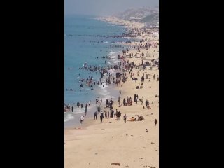 Gazans at the beach in Deir el-Balah, central Gaza Strip