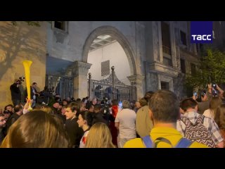 The side entrance gate to the Georgian parliament, where protesters and oppositionists gathered, was reinforced with a huge bolt