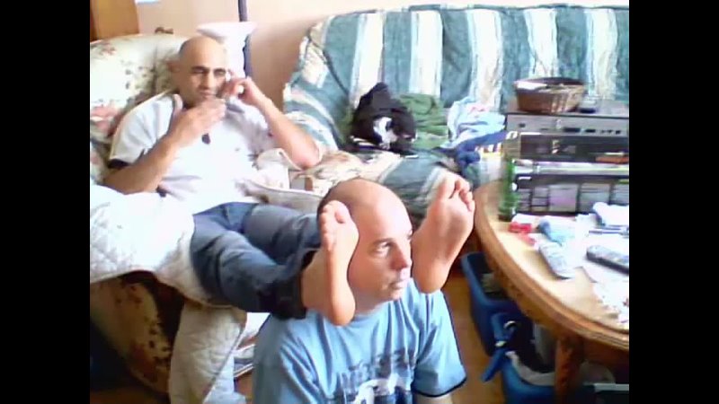 Playing with Master's feet while he talks at the phone