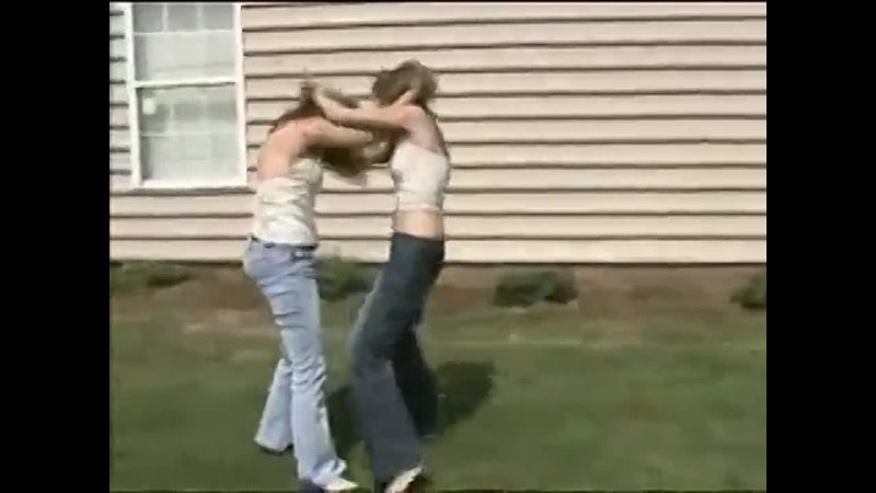 Nice girls wrestling outside in jeans