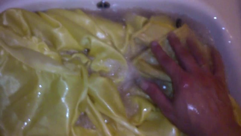 Washing The New Yellow Satin Prom Dress.