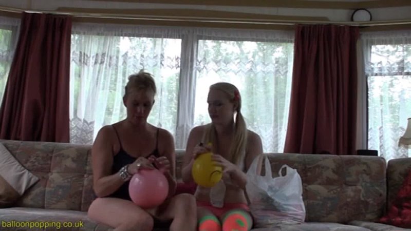 Mom and Daughter blow balloons