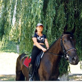Фотография "Я на работе. Фото 2007 года. Со своим конём которого воспитываю ."