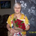 Фотография "моя мамуличка в свой юбилейный День Рождения с букетом шикарных роз от нашей семьи .люблю тебя моя родная мамуля"
