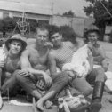 Фотография "Примерно лето 1978 г. Укладка парашютов. Слева направо:я, Женя Петухов, Вова Баринов, Вова Старчиков."