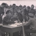 Фотография "Армия. 1963 или 64 г. Подольск, Кузнечики. Соревнования между частями. Судейская коллегия, я-крайний слева, склонился к протоколам."