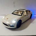 Фотография "Porsche Panamera, масштаб 1 /24, металл, свет, звук, имитация дыма, двери, капот и багажник открываются. Цена 2000 "