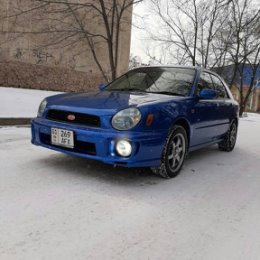 Фотография "продаю Subaru Impreza 2001 года объём 1.5 механика 5 ступка, правый руль, японец 2WD передний привод с завода, цвет blue mica (самый приятный из синих) прямоток "Tom's" оригинал звук приятный голова не болит, водительское сиденье ковш "STI RECARO" диски кованые "Volk monoblock forged" машина без вложений, цена 3800$ мини торг, 0509 508 507 обмена нет"