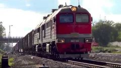 2М62у-0042 с грузовым поездом