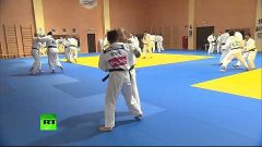 Judo Chop! Putin spars with Russian team in Sochi