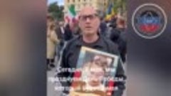 An action Immortal Regiment with portraits of the dead child...