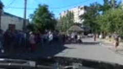 Melitipol - people waiting in line to get Russian passports ...