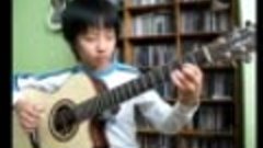 Очень юный мальчик безумно красиво играет на гитаре