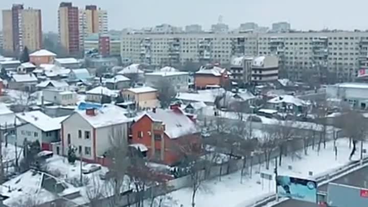 Пархает снежок над городом