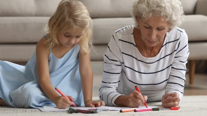 happy-small-girl-drawing-with-older-mature-grandmother-at-home-SBV-3 ...