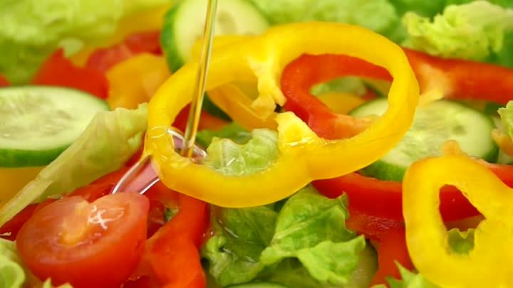 mixkit-slices-of-vegetables-falling-over-salad-17847-large