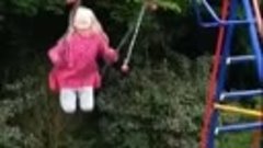 cat and little girl on swing