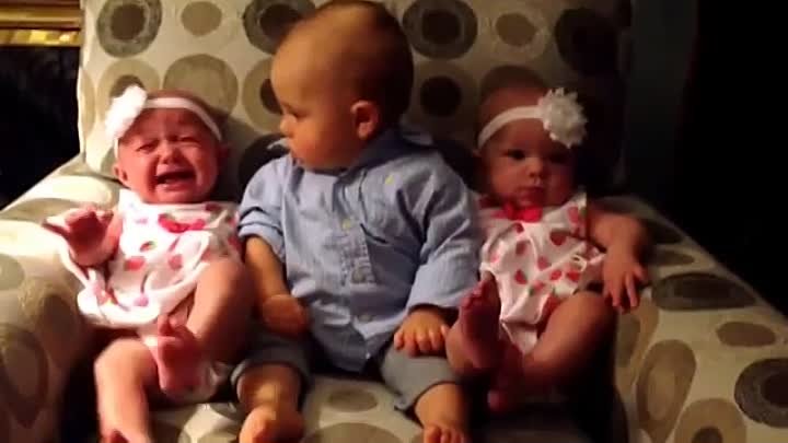 Adorably confused baby meets twins