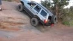 Jeep Grand Cherokee (WJ) climbing a steep slab (Moab, UT)