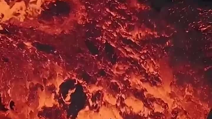 Lava flows from crater in Iceland during volcanic eruption
