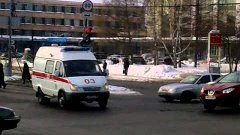 Russian ambulance responding through red light with lights a...